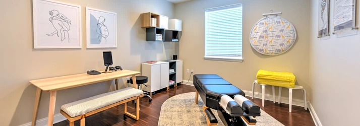 Chiropractic Ponte Vedra Beach FL Book Now Hero A treatment area at Life Family Chiropractic with scanning equipment and an adjustment table
