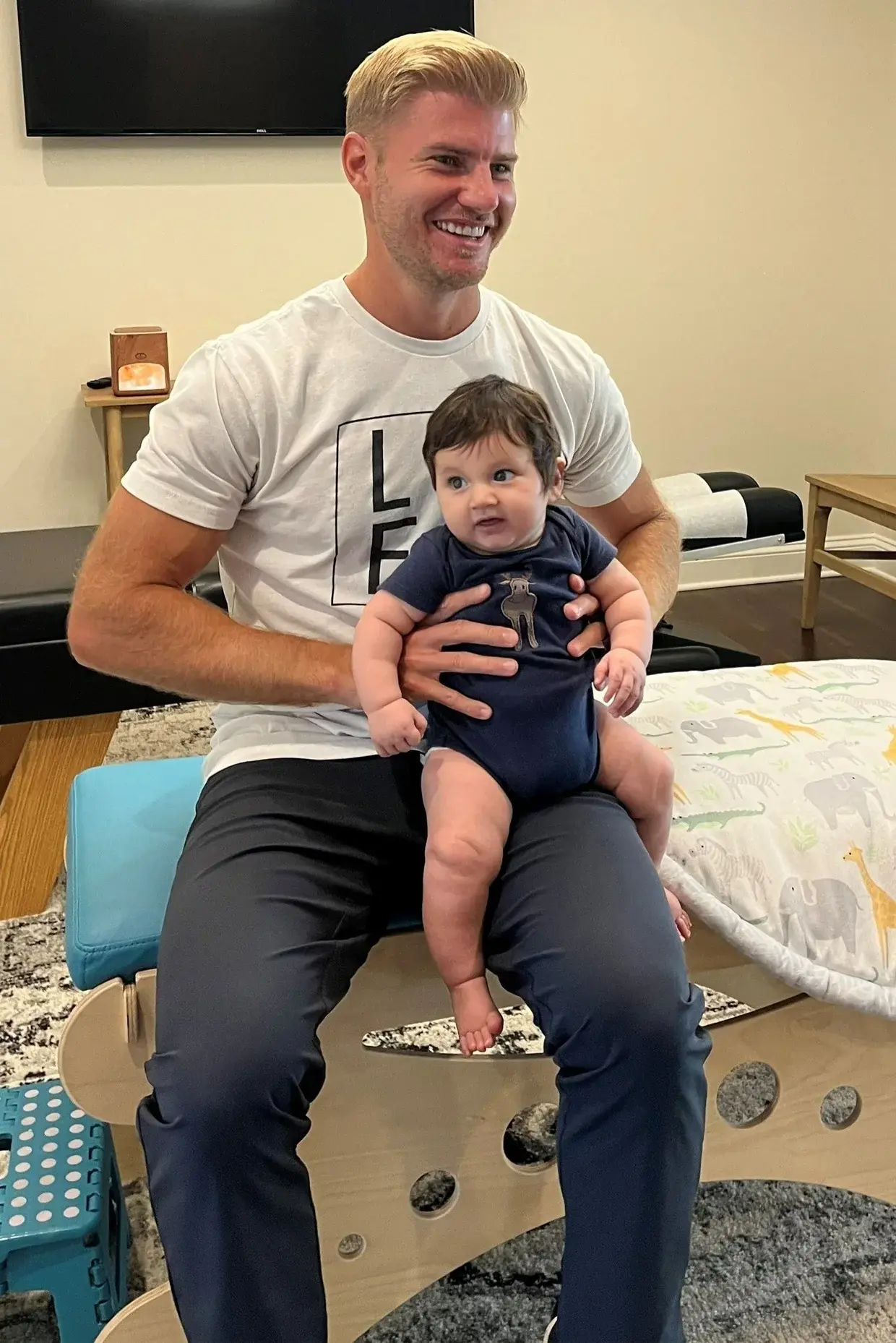 Chiropractor Nocatee FL Brett Lukas Holding Baby HP Dr. Brett Lukas of Life Family Chiropractic holding a baby after an adjustment