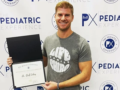 Chiropractor Ponte Vedra Beach FL Brett Lukas Certificate Dr. Brett Lukas accepting a certificate at the Pediatric Experience